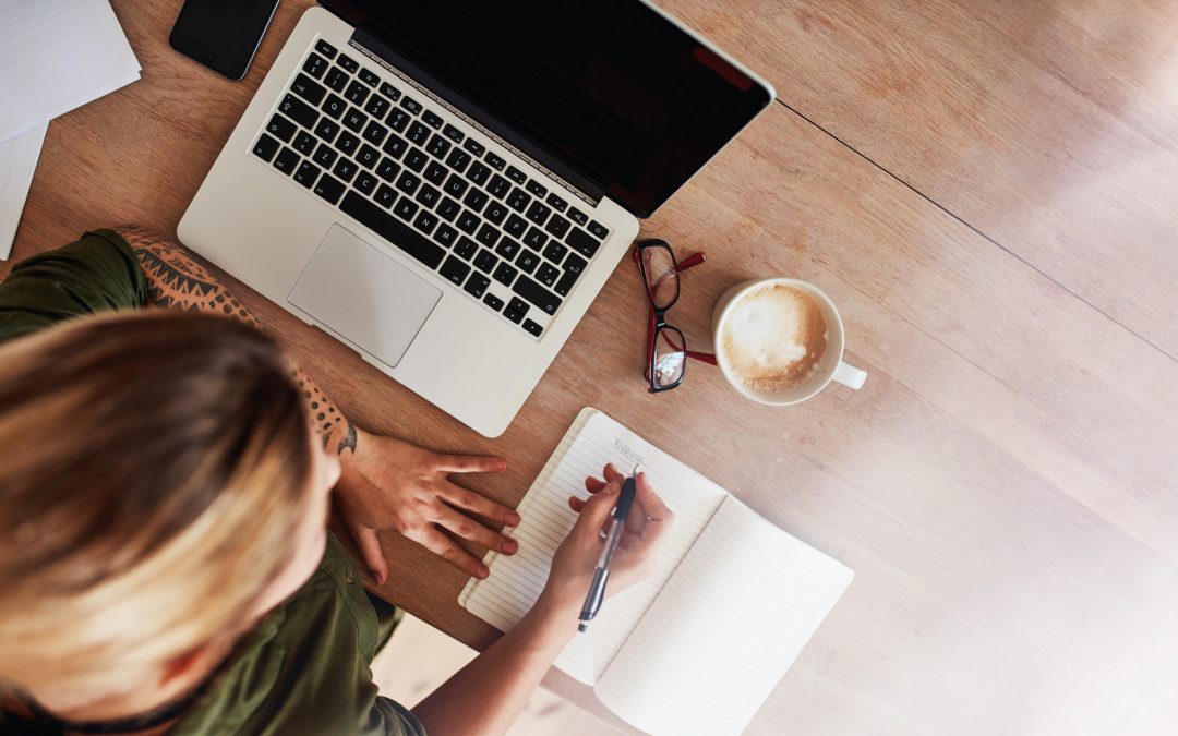 Woman making to do list on diary